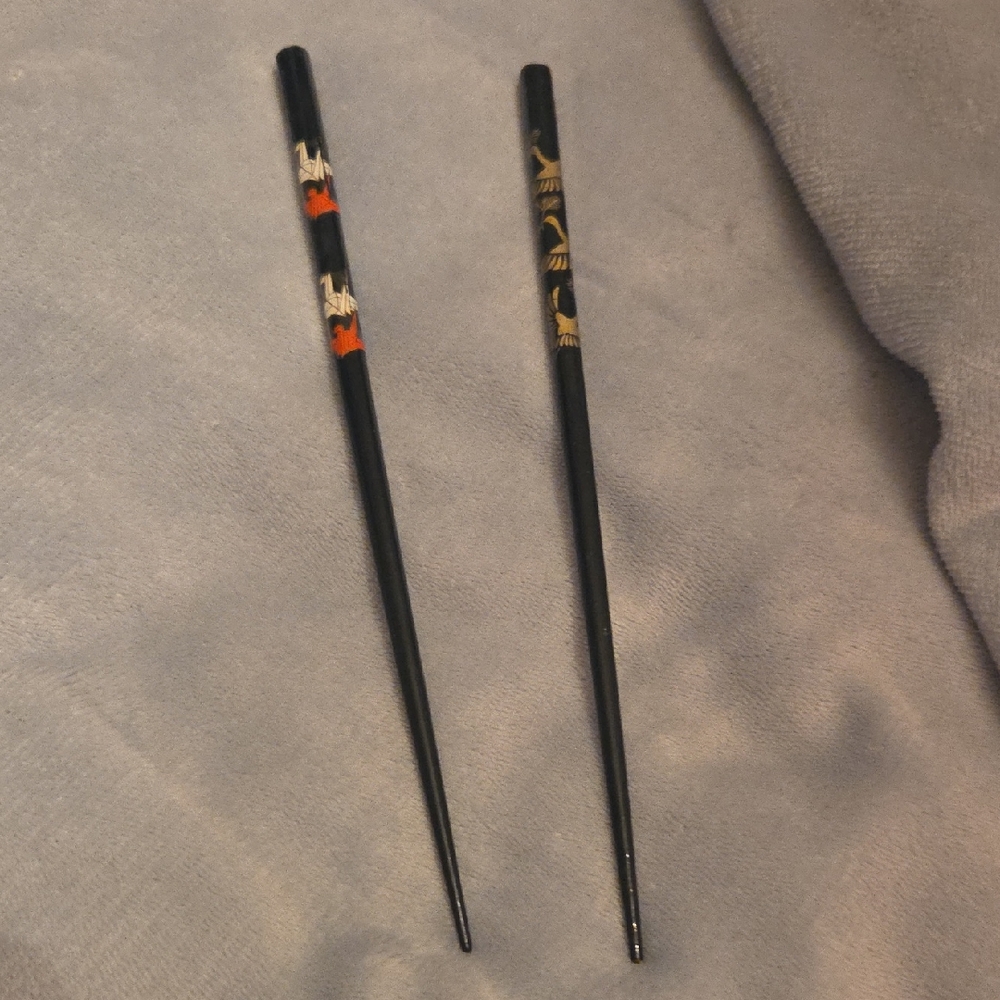 Elegant Black Chopsticks with Gold and Red Accents